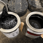 Two containers of modified asphalt binders