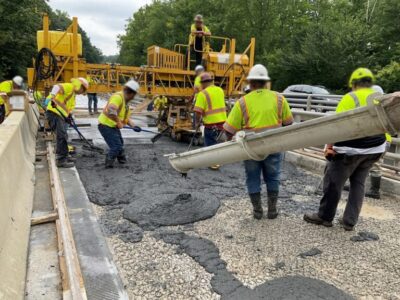 Workers installing concrete